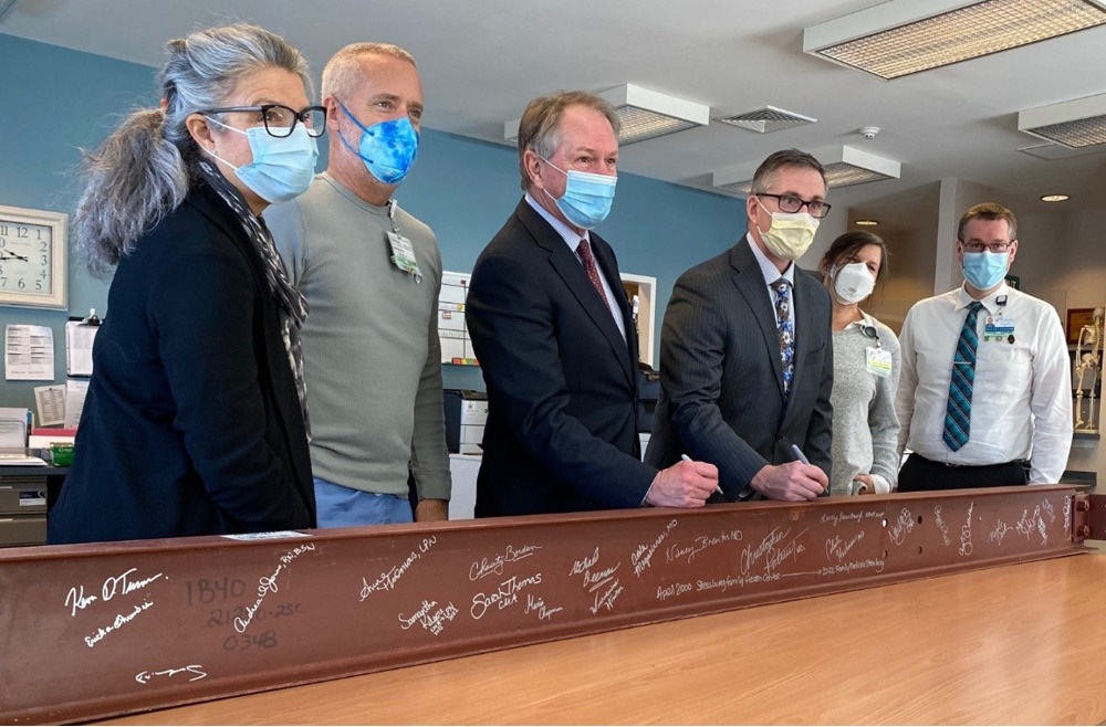 LG Health employees signing beam